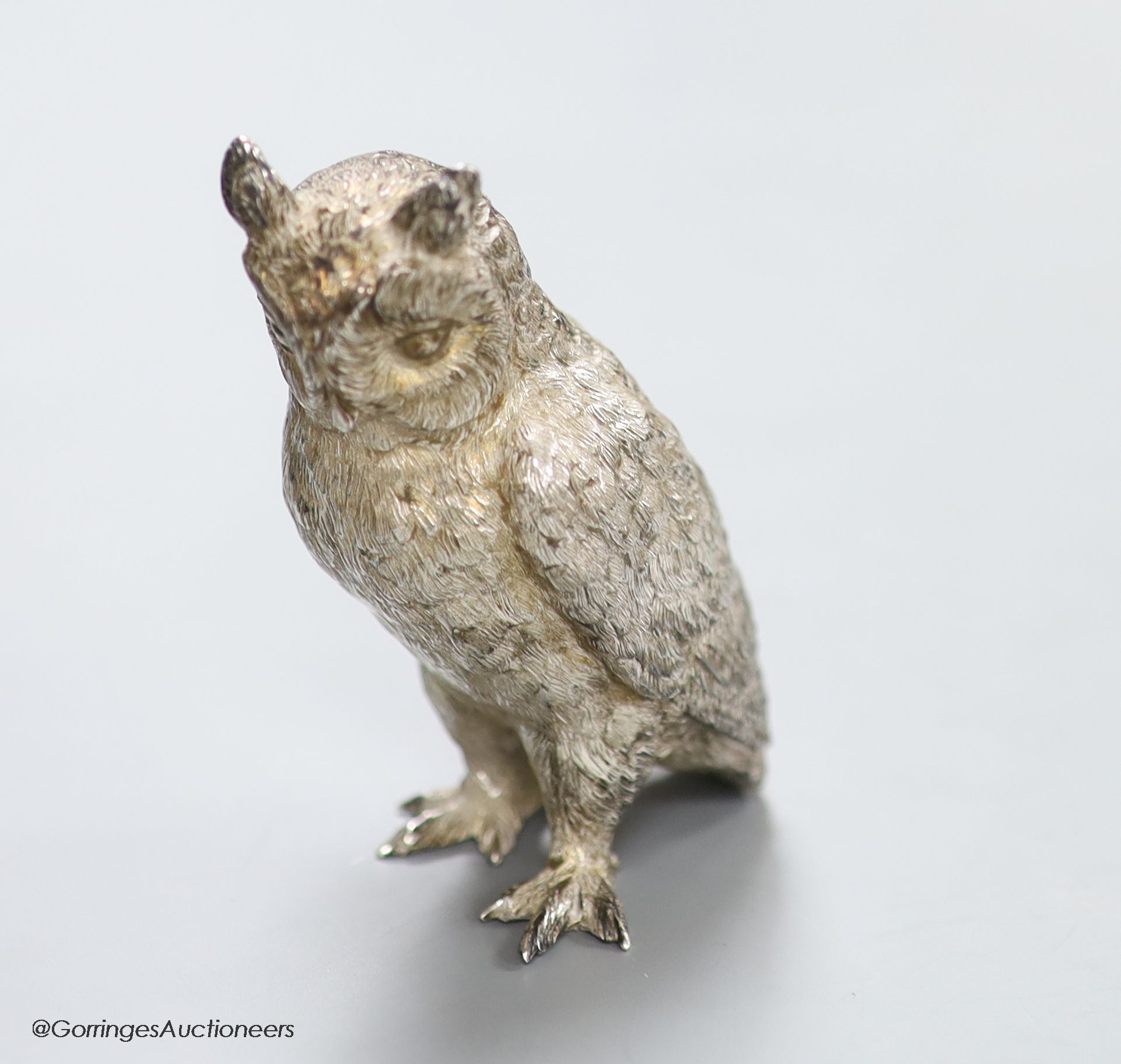 A modern free standing miniature silver model of an owl, C.F.H & Co, London, 1994, height 8cm, 195 grams.